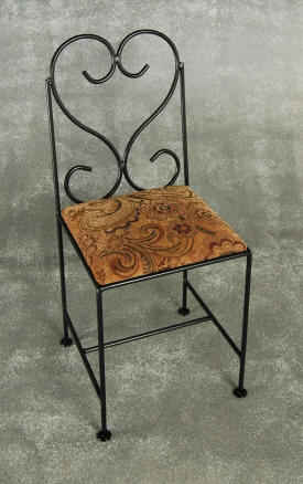 French curl metal dining chair with upholstered seat